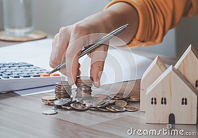 Female`s hand put coin stack money staircase on table, Business Growth concept, Financial risk. for plan saving finance Stock Photo