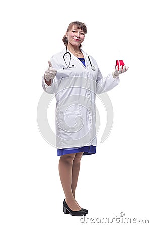 Female scientific researcher in protective gloves holding beaker with red liquid solution at pharmacy microbiology Stock Photo