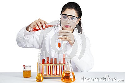 Female scientist pouring experiment liquid Stock Photo