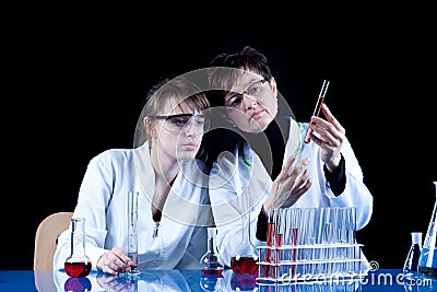 Female Scientists experimenting Stock Photo