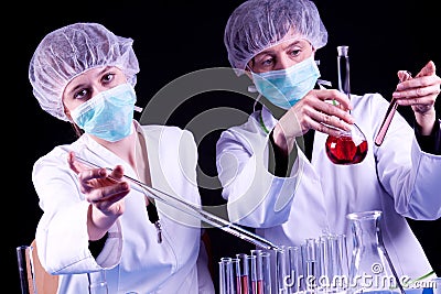 Female Scientists experimenting Stock Photo