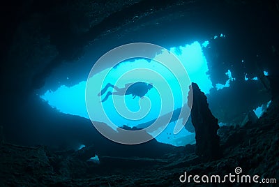 Female scuba diver exploring ship wreck Stock Photo