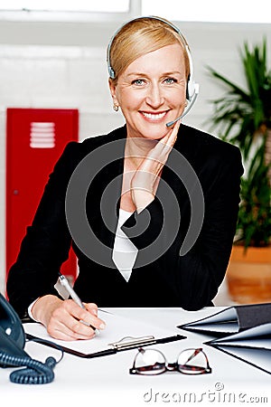 Female secretary confirming appointment Stock Photo