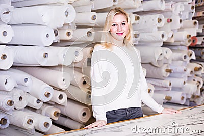 Female shop assistant demonstrating assortment Stock Photo