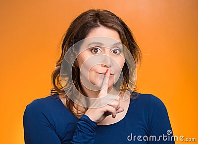 Female showing hand silence sign Stock Photo