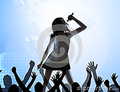 Female singer on stage Stock Photo