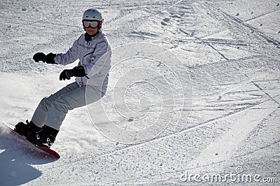 Female snowboarder in powder snow Stock Photo