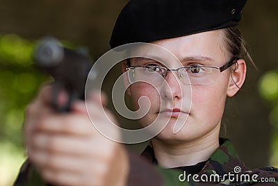 Female soldier targeting with a gun Stock Photo