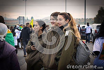 Female soldiers and citizens marching in the city of Golani Junction, Israel Editorial Stock Photo