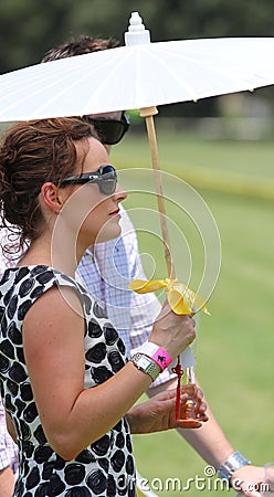 Female Spectator at the Polo Editorial Stock Photo