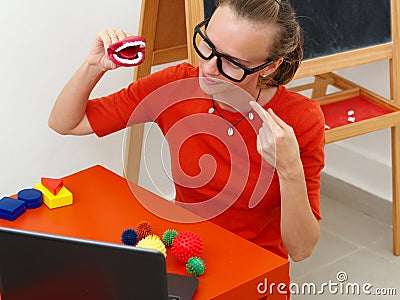 A female speech Therapist conducts an online. Stock Photo