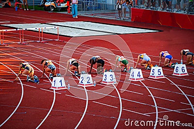Female Sprinters Lined Up at the Starting Blocks for the 100m Race: Precise Moment Captured on the Athletic Track. Track and field Cartoon Illustration