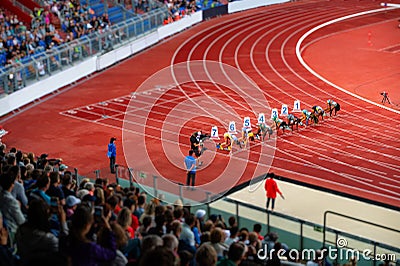 Female Sprinters at the start line of the 100 meters sprint race. Track and Field photo for Summer Game in Paris Editorial Stock Photo