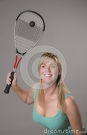 Female squash player with raquet and ball Stock Photo