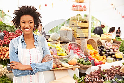 Female Stall Holder At Farmers Fresh Food Market Stock Photo