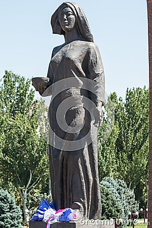 Female statue awaiting the return of her husband from war. Victory Square in Bishkek, Kyrgyzstan Editorial Stock Photo