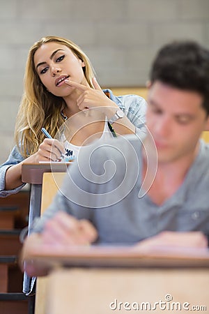 Female student cheating on her classmate Stock Photo