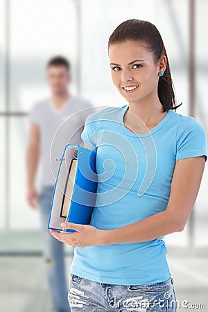 Female student holding folder Stock Photo