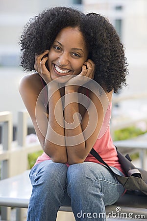 Female student sitting outside Stock Photo