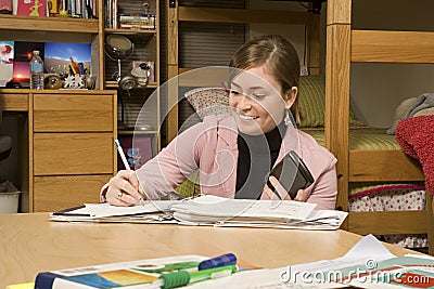 Female student studying in her dormitory Stock Photo