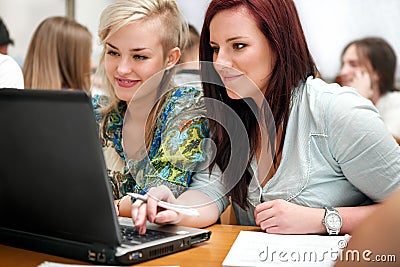 Female students using a laptop Stock Photo