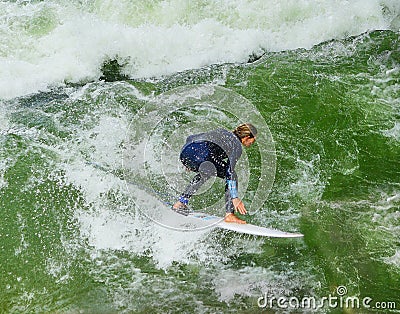 Female Surfer in the Unique Urban Surfing Eisbachwelle in Munich Germany Editorial Stock Photo