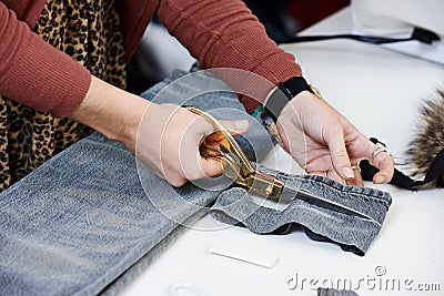 Female tailor hands at work Stock Photo