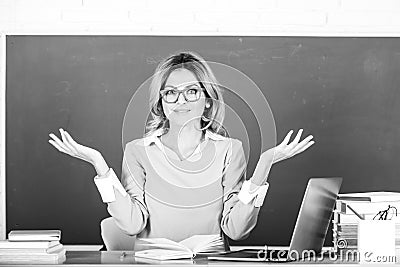 Female teacher. Pretty young high school or college teacher on the chalkboard. Young caucasian female teacher portrait Stock Photo