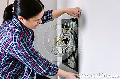 Female technician measuring telecommunication box Stock Photo