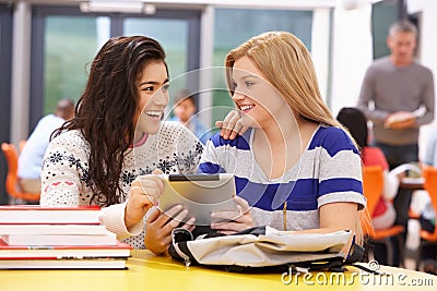Female Teenage Students In Classroom With Digital Tablet Stock Photo