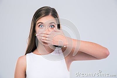 Female teenager covering her mouth Stock Photo