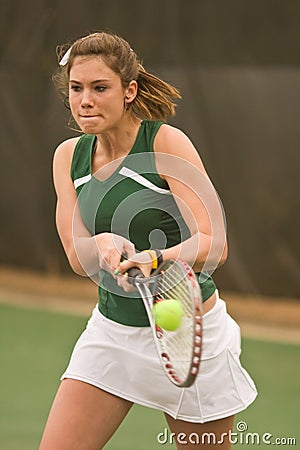 Female Tennis Players Smacks Backhand In Match Stock Photo