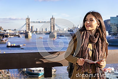 Female tourist in London holding a city map Stock Photo