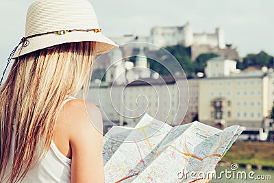 Female tourist on vacation in Salzburg Austria holding a local map Stock Photo