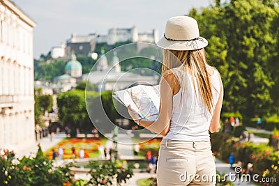 Female tourist on vacation in Salzburg Austria holding a local map Stock Photo