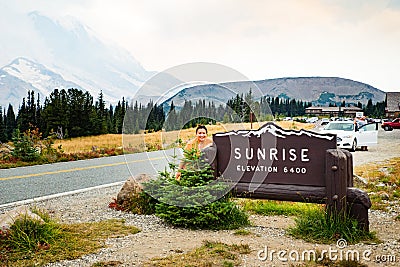 Female tourist visiting Mt Rainier at Sunrise visitor center Stock Photo