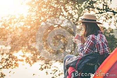 Female tourists camping in beautiful nature in tranquil scene. Stock Photo