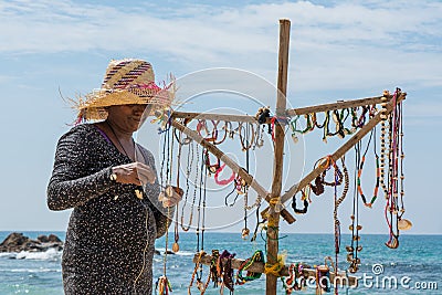 Female trader in the souvenir shop on the beach Editorial Stock Photo