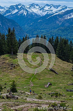 Female trailrunning in the mountains of Allgau near Oberstdorf, Germany Stock Photo