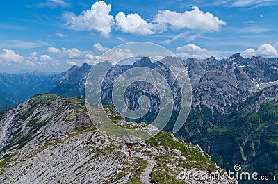 Female trailrunning in the mountains of Allgau near Oberstdorf, Germany Stock Photo