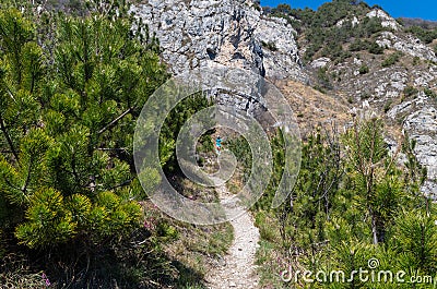 Female trailrunning in mountains at Lake Garda, Italy Stock Photo