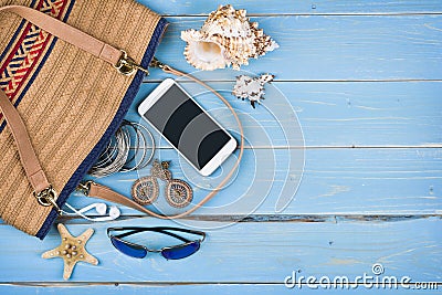 Female travel accessories over tropical blue textured wooden background Stock Photo