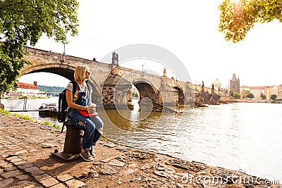 Female traveler enjoys views of the Charles Bridge in Prague Stock Photo