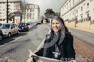 Female traveler holding and reading tourist map Stock Photo