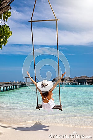 Female traveller enjoys her tropical summer vacation Stock Photo