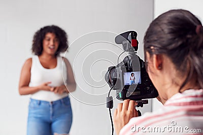 Female Videographer Recording Woman Recording Podcast In Studio Stock Photo