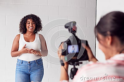 Female Videographer Recording Woman Recording Podcast In Studio Stock Photo