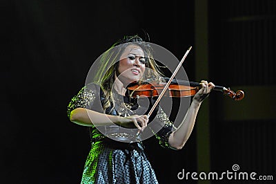 Female virtuoso violin player Editorial Stock Photo