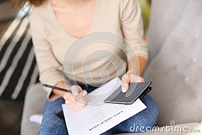 Bride execute documents to get visa for honeymoon. Stock Photo