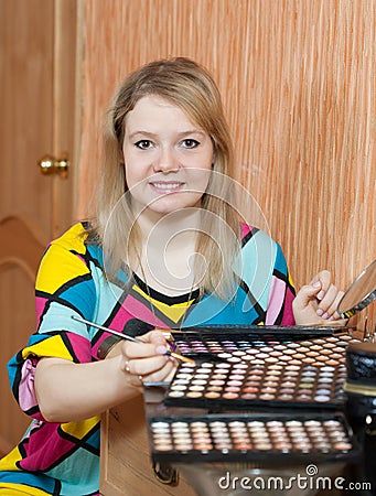 Female visagiste with cosmetics Stock Photo
